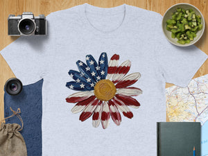 Light grey t-shirt featuring a daisy with American flag petals and gold center.