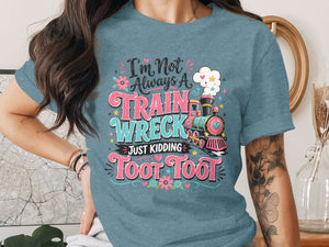 Blue t-shirt with "I'm Not Always A Train Wreck Just Kidding Toot Toot" text and train graphic.