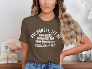 Brown t-shirt with "One moment, let me overthink this" text.