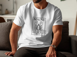 White t-shirt with a black lobster design, "MAINE", "NEW ENGLAND", and "U.S.A."