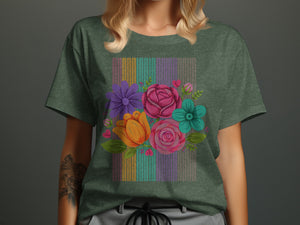 Green t-shirt with colorful embroidered flowers and vertical striped background.