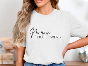 White t-shirt with script text "No rain... NO FLOWERS."