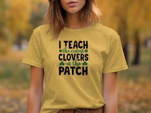 Yellow t-shirt with black text "I TEACH the cutest CLOVERS in the PATCH" and shamrocks.