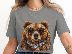 Grizzly bear wearing sunglasses and a diamond necklace on a grey t-shirt.