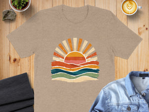 T-shirt with retro sunset graphic and rolling colorful hills.