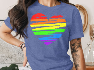 Blue t-shirt with a painterly rainbow heart graphic across the chest.