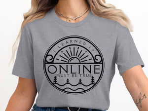Grey t-shirt with a circular graphic that reads "I LEARNED IT ONLINE MUST BE TRUE".