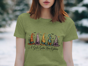 Green t-shirt with five colorful witch hats and the text "A Girls Gotta Have Options".