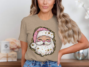T-shirt with a cartoon Santa Claus graphic featuring a pink polka dot hat and leopard print border.