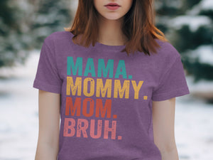 Purple t-shirt with "MAMA. MOMMY. MOM. BRUH." in distressed colorful text.