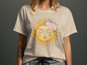 Beige t-shirt with a graphic of a sun wearing a floral crown.
