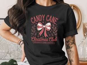 Black t-shirt with "Candy Cane Christmas Club" graphic and bow.