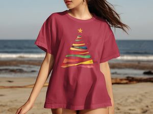 Maroon t-shirt with a colorful abstract Christmas tree graphic and a yellow star.