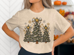 T-shirt with three decorated Christmas trees, bows, stars, and snowflakes.