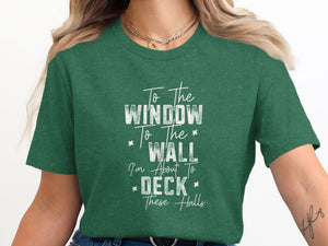 Green t-shirt with white text: To The Window To The Wall I'm About To Deck These Halls.