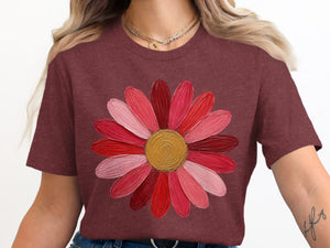 Maroon t-shirt with a colorful abstract flower graphic.