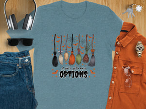 Teal t-shirt with cartoon brooms and text "A girl's gotta have OPTIONS."
