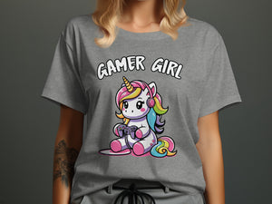 "Gamer Girl" text above a cartoon unicorn with rainbow hair and headphones, playing a video game.