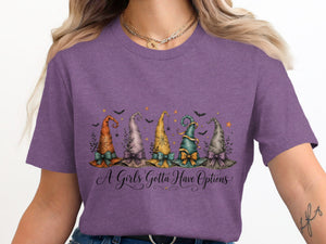 Purple t-shirt with five decorative witch hats and text "A Girls Gotta Have Options."