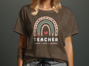 Brown t-shirt with rainbow graphic and the words "TEACHER TEACH LOVE INSPIRE".