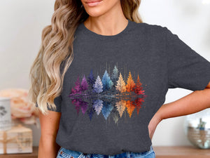 T-shirt with colorful watercolor trees reflected in water.
