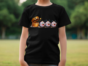 Black t-shirt with cartoon food escaping treasure chest on a park background.