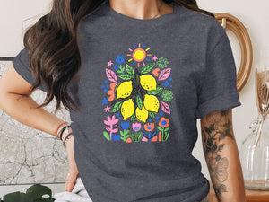 Dark gray t-shirt with a bright, colorful graphic of lemons and flowers.