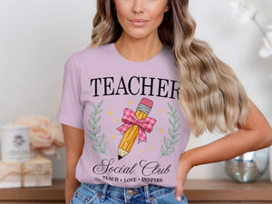 Lilac t-shirt with "TEACHER Social Club" and pencil graphic.