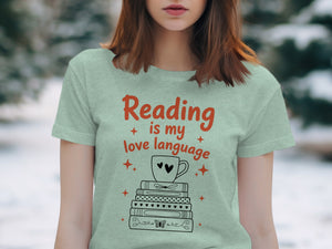 Light green t-shirt graphic with "Reading is my love language" and stacked books.