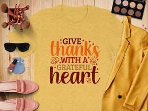 Yellow t-shirt with text "GIVE thanks WITH A GRATEFUL heart".