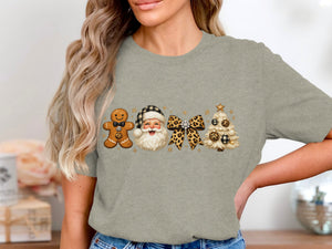 Gingerbread man, Santa, leopard bow, and Christmas tree graphic on a grey shirt.