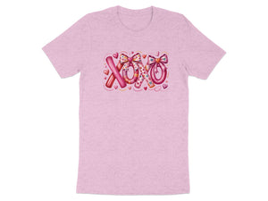 Pink t-shirt with "XOXO" text graphic with hearts and bows.