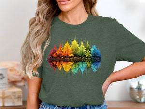 Rainbow forest with reflection graphic on a dark green t-shirt.