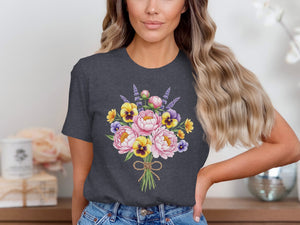 Dark gray t-shirt with a watercolor bouquet of pink peonies, yellow pansies, and lavender.