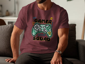 Maroon t-shirt with "Gamer Squad" text and pixelated gamepad graphic.