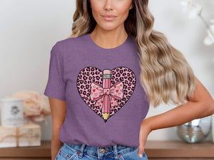 Purple t-shirt with leopard print heart graphic and pink pencil with bow and hearts.
