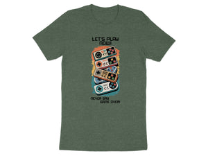 Green t-shirt with stacked retro game controllers and text "Let's Play Now!"