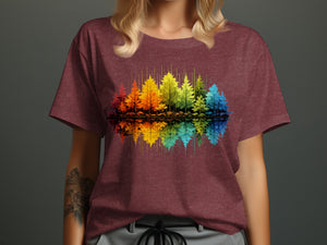 Maroon t-shirt with colorful trees graphic reflected in water.