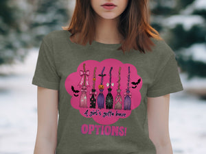 T-shirt design with multiple decorative brooms, bats, ghosts, and text.