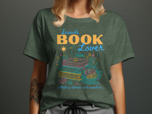 Seaside BOOK Lover graphic with stacked books, seagull, sun, shells, and text.