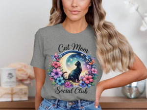 Cat Mom Social Club text on gray t-shirt with black cat, moon, and flowers.