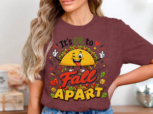T-shirt graphic of a winking taco saying "It's OK to Fall APART."