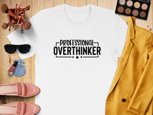 White t-shirt with "PROFESSIONAL OVERTHINKER" text and decorative stars.