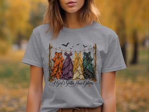 Four colored Halloween dresses hanging on a clothesline with bats above and text.