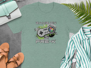 Green t-shirt with "GAME ON PRE-K" and video game controller graphic