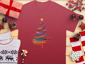 Maroon t-shirt with colorful abstract Christmas tree graphic and star.
