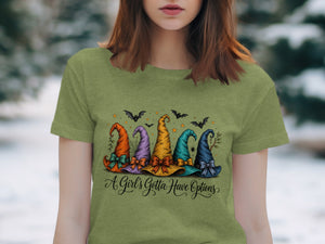 Five colorful witch hats with "A Girl's Gotta Have Options" text on a green shirt.