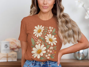 Brown t-shirt with a large white daisy floral design and small pink and white flowers.