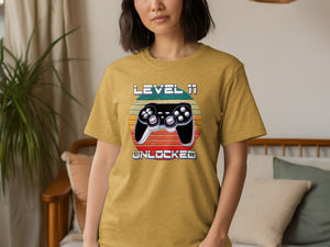 Yellow t-shirt with graphic "LEVEL 11 UNLOCKED" and video game controller.