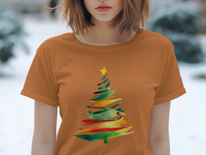 Orange t-shirt with abstract watercolor Christmas tree design.